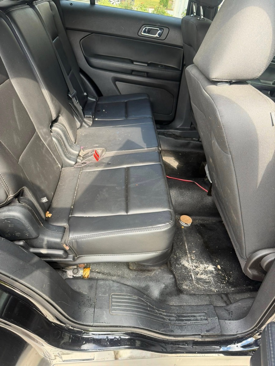Stained and dirty back seat before upholstery cleaning