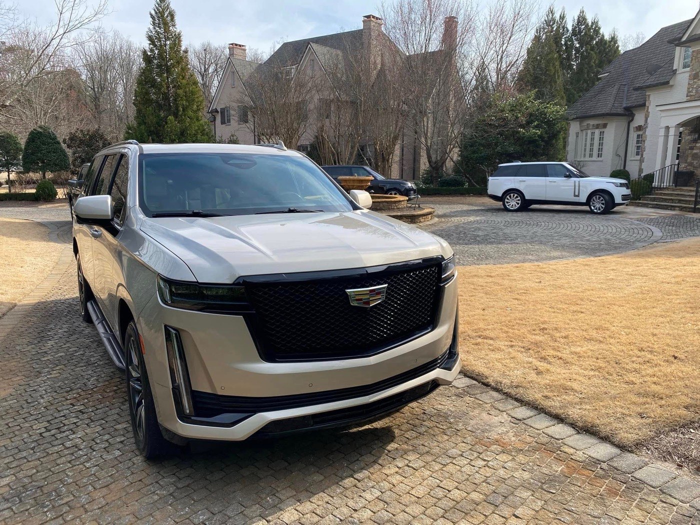 Detailed Cadillac Escalade shining in a driveway