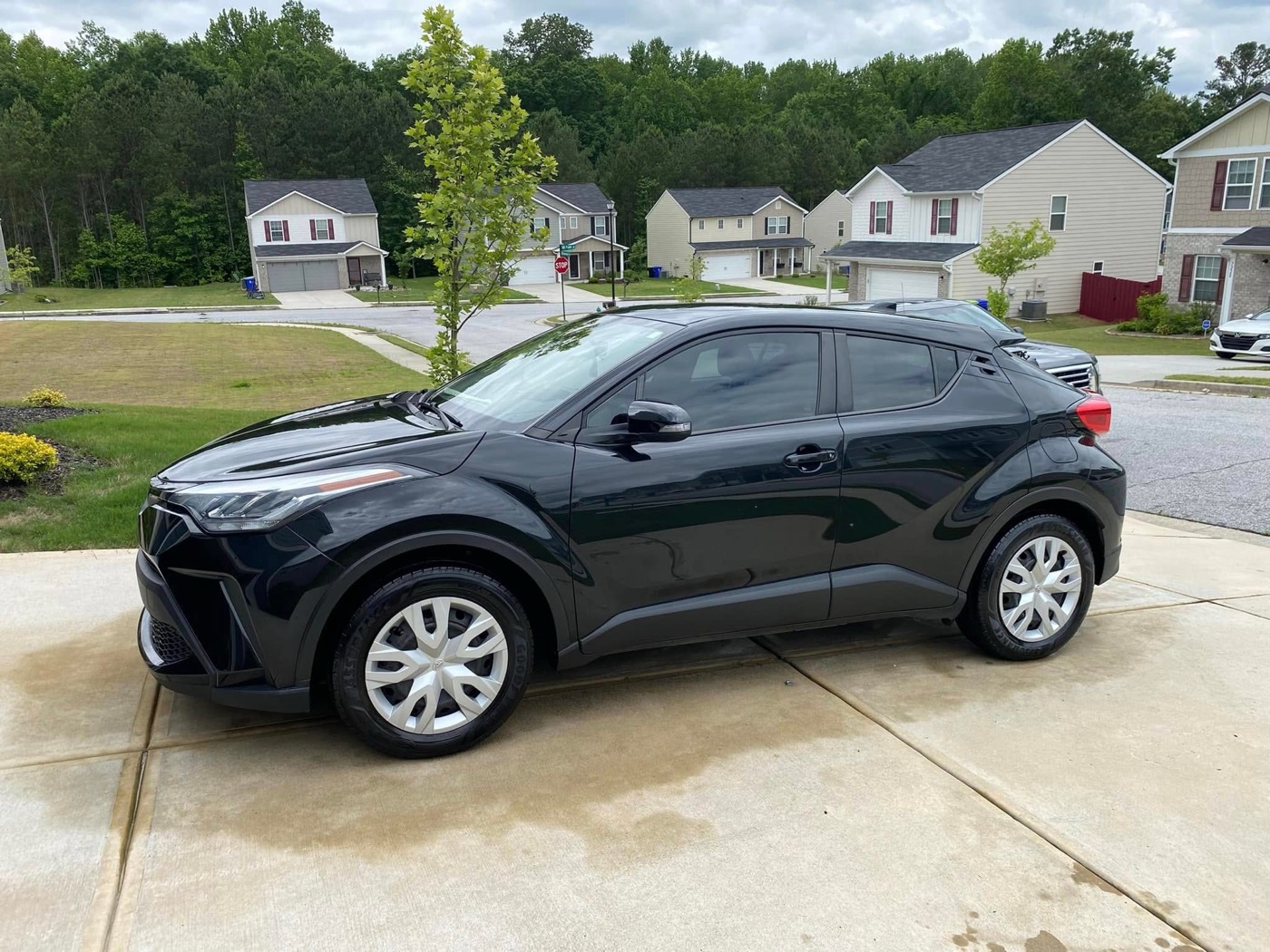 Clean SUV parked in a residential driveway after detailing