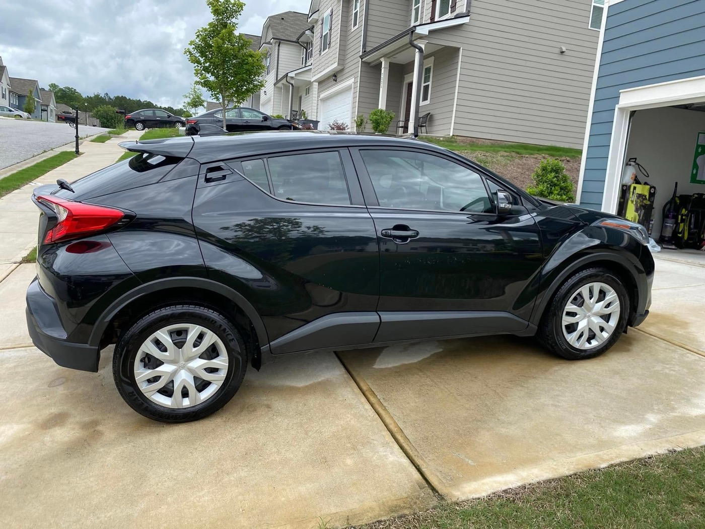 Detailed Toyota in a driveway with a fresh shine