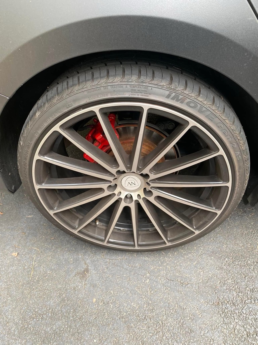 Dirty wheel and rim caked with brake dust before detailing